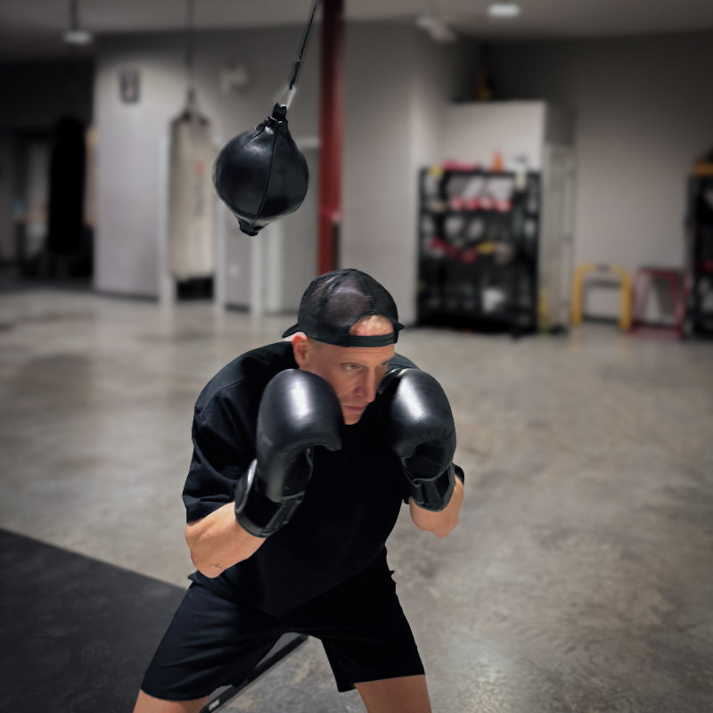 boxer using the spar rope as a slip bag
